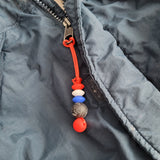 Tirette HOCKEY pour fermeture éclair, zipette, aide l'autonomie des petits, accessoire sensoriel, bille de silicone